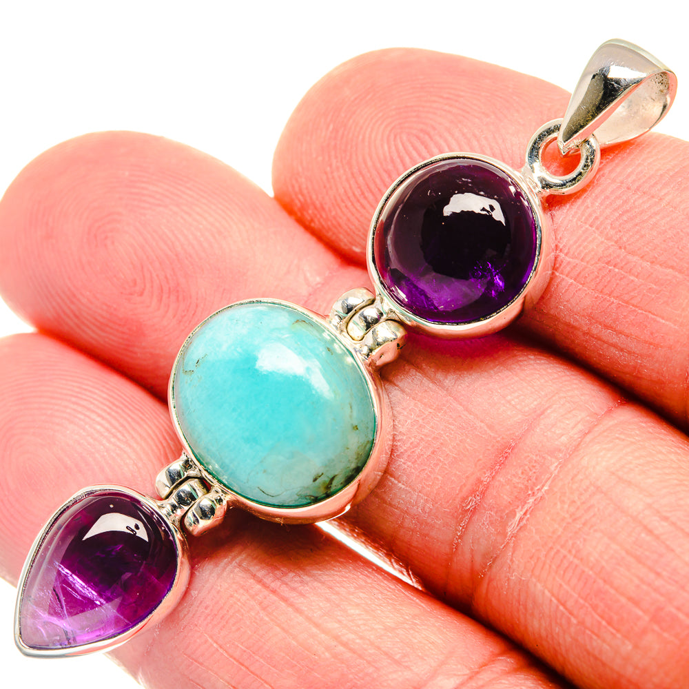 Sterling silver pendant with bail, purple amethyst round gems and blue-green larimar center oval.