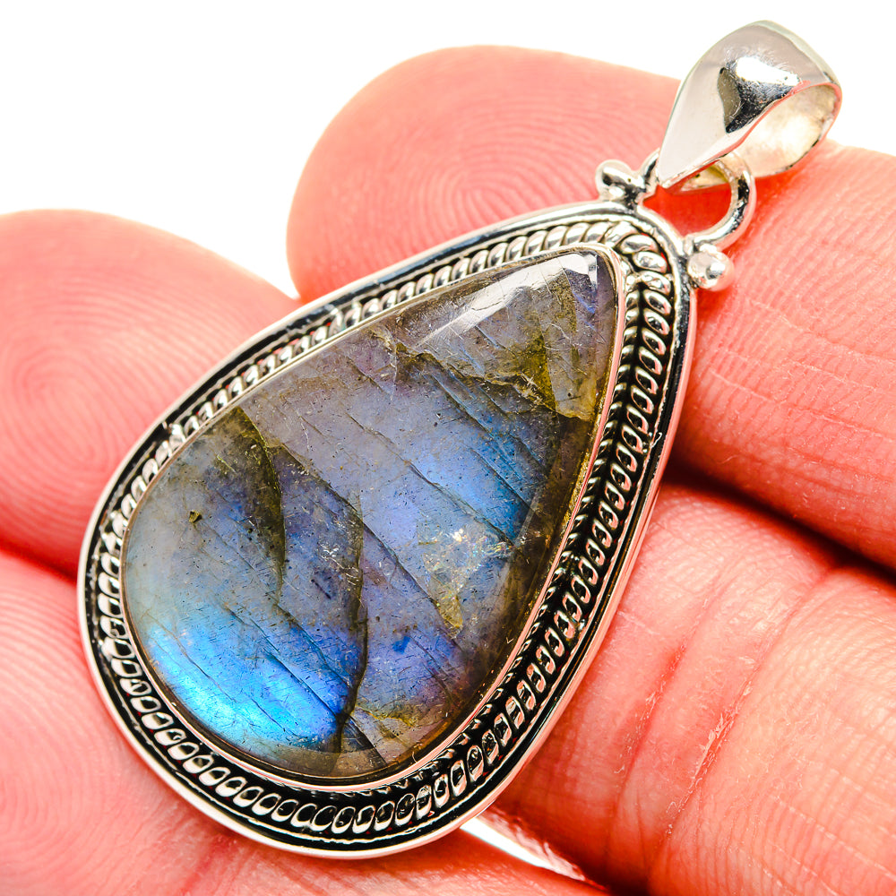 Labradorite teardrop pendant, blue-gold flash, ornate sterling silver setting