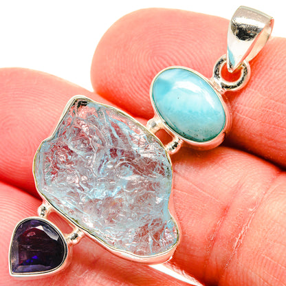 Rough light-blue stone pendant with teal oval setting and heart-cut amethyst detail