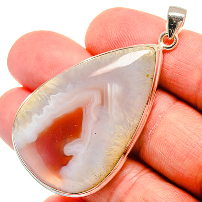 Ocean jasper teardrop pendant in 925 sterling silver, white shell with red-orange swirls
