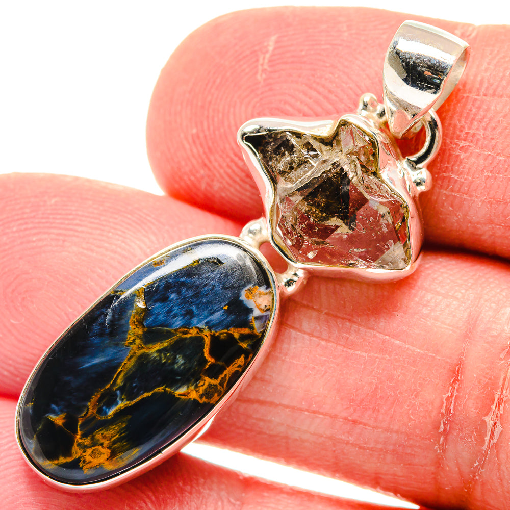 Sterling silver pendant with blue-gold pietersite oval and clear quartz crystal charm
