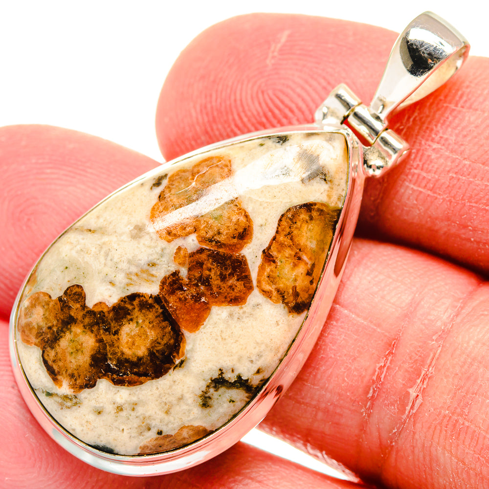 Muscovite teardrop pendant in 925 sterling silver with brown mottled stone
