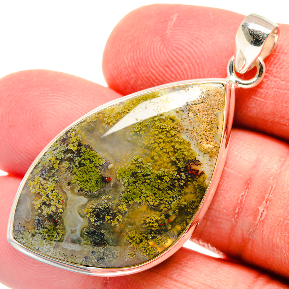 Sterling silver plume agate pendant teardrop close-up, green-yellow mossy stone