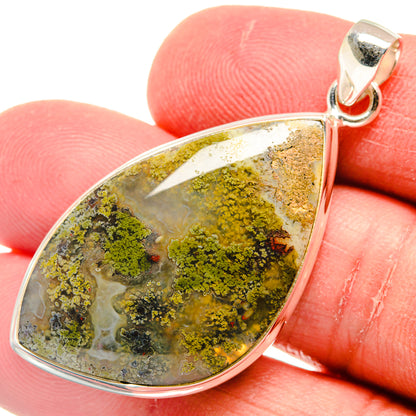 Sterling silver plume agate pendant teardrop close-up, green-yellow mossy stone