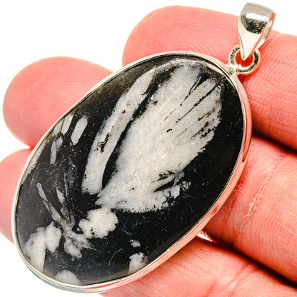 925 sterling silver pendant with oval black stone and white veining, bail at top