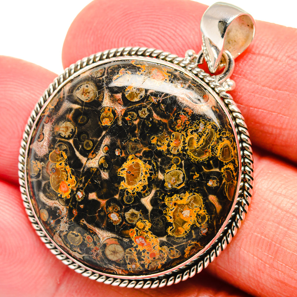 Oval sterling silver pendant with detailed poppy jasper mottled pattern and bail close-up