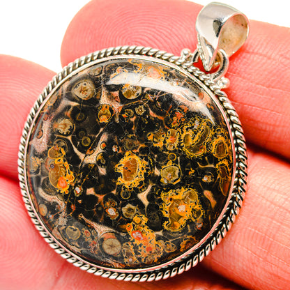 Oval sterling silver pendant with detailed poppy jasper mottled pattern and bail close-up