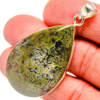 Plume agate pendant with teardrop cabochon, green and yellow speckled plume pattern