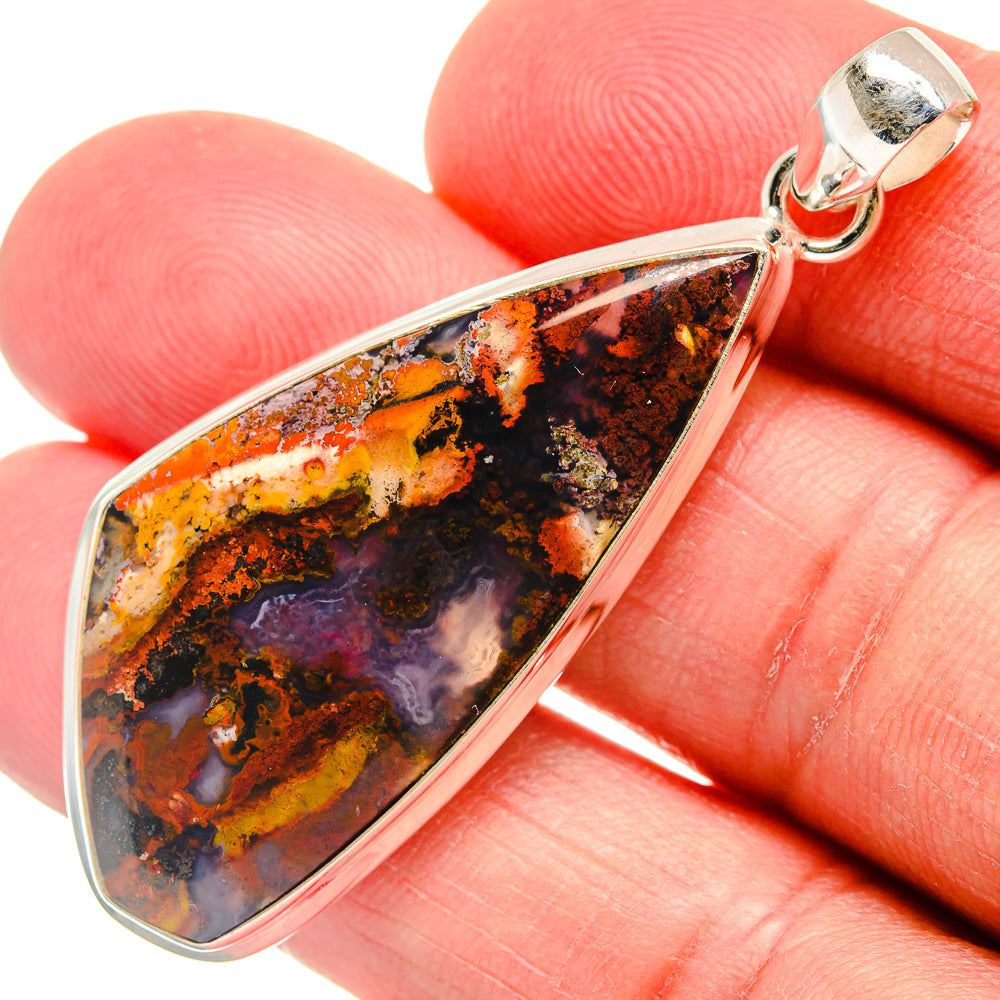 Teardrop plume agate pendant in sterling silver; orange, black, and purple stone