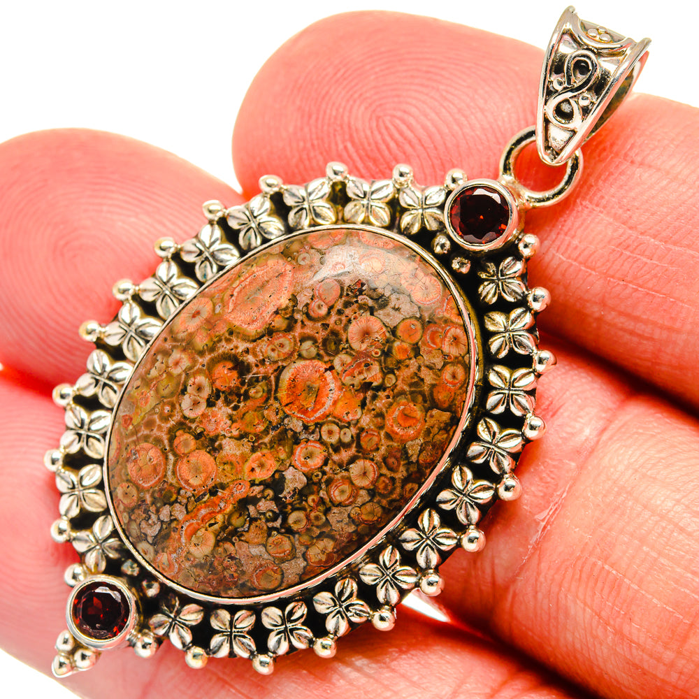 925 sterling silver pendant with oval poppy jasper and red garnet stones, floral bezel border.