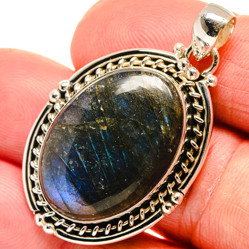 Labradorite pendant close-up with blue-green shimmer in 925 sterling silver bezel