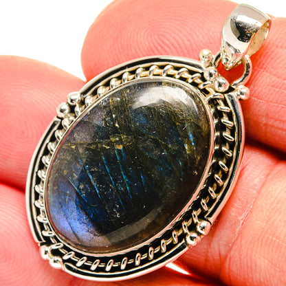 Labradorite pendant close-up with blue-green shimmer in 925 sterling silver bezel