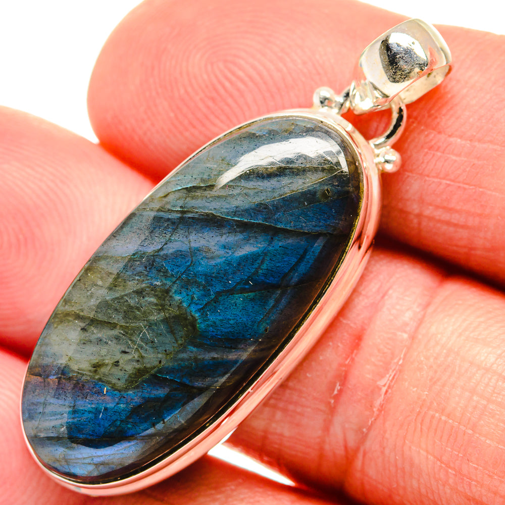 Oval labradorite pendant close-up with blue flash stone and silver bail, 925 sterling