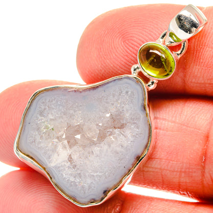 Sterling silver geode slice pendant with green peridot cabochon and white crystal druzy