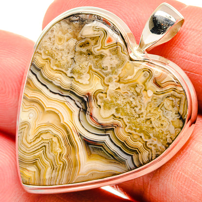Sterling silver heart pendant with yellow-brown agate inlaid and loop bail