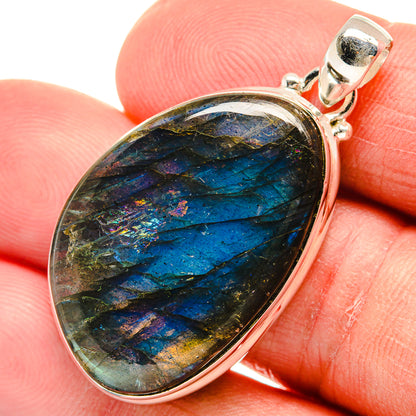 Teardrop labradorite pendant with blue-green iridescent stone in sterling silver bezel
