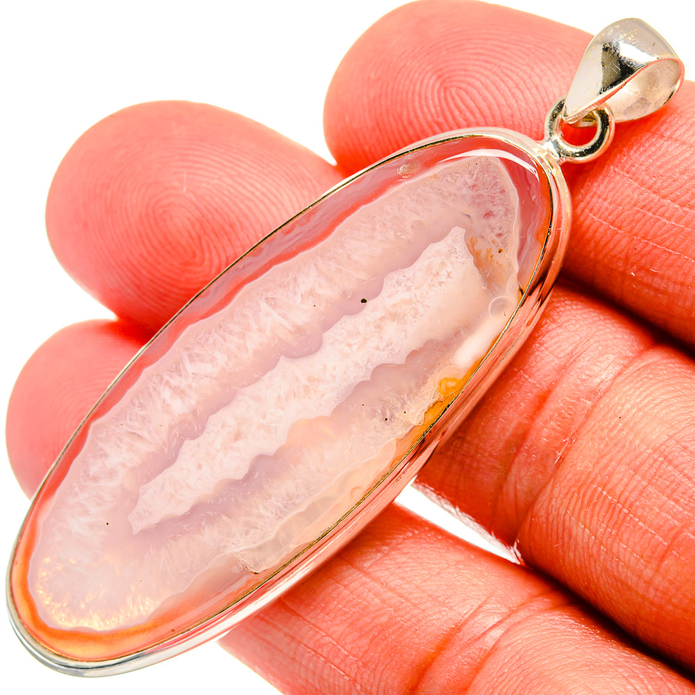 Teardrop agate pendant in 925 sterling silver bezel and bail, orange-pink.