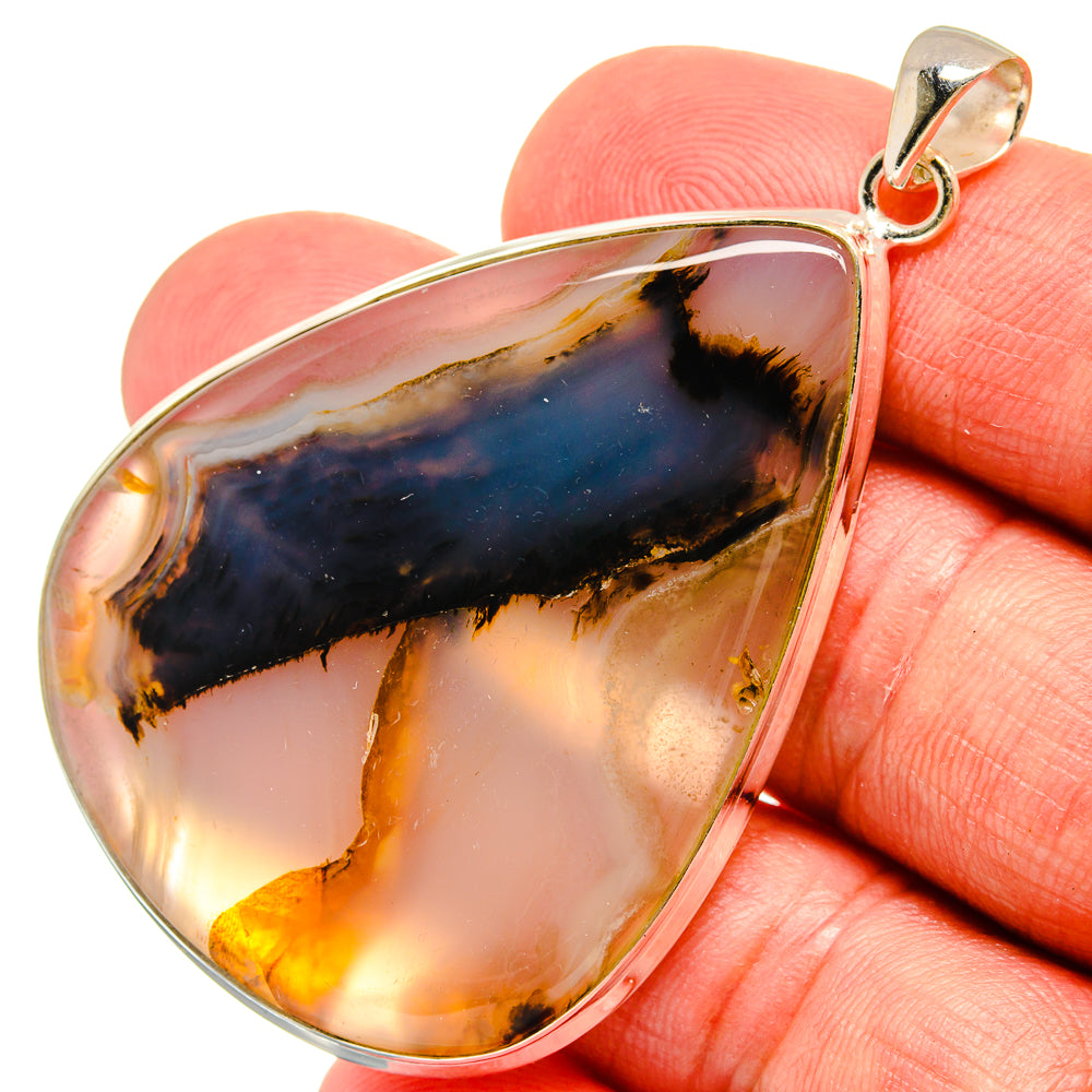 Sterling silver teardrop agate pendant with amber, honey, and dark blue tones