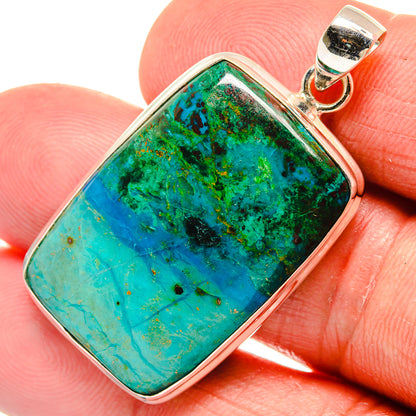 Rectangular chrysocolla pendant close-up in polished 925 sterling silver bezel.