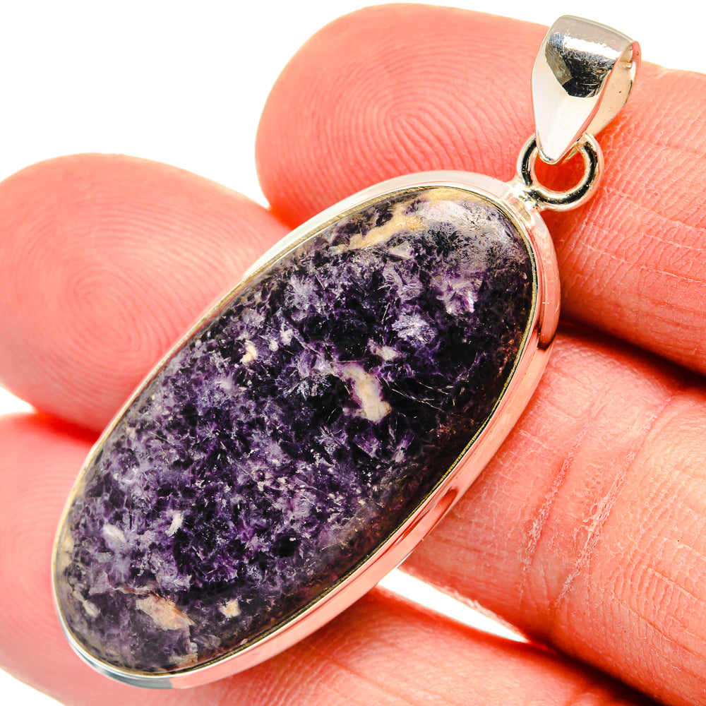 Kammererite gemstone pendant in oval sterling silver bezel with bail and purple veining.