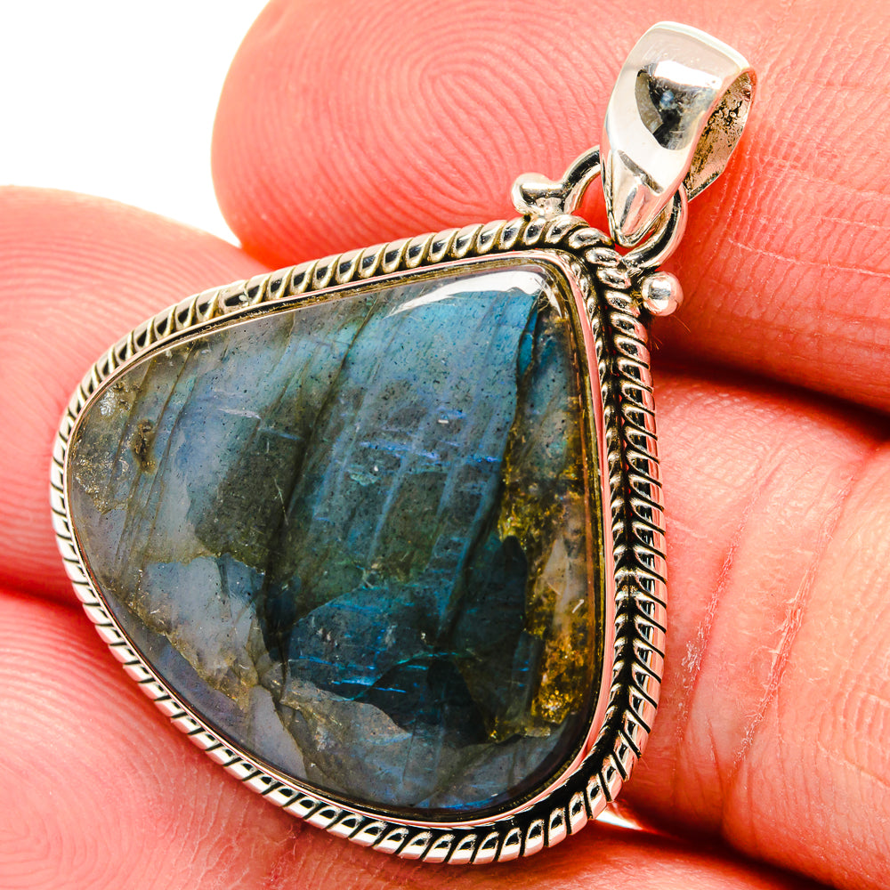 Labradorite teardrop pendant, faceted blue-green flash in sterling silver rope frame