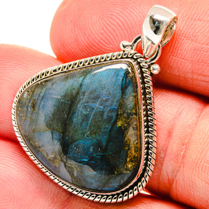 Labradorite teardrop pendant, faceted blue-green flash in sterling silver rope frame