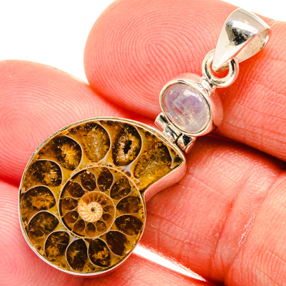 Close-up: sterling silver teardrop ammonite pendant with opal cabochon and golden fossil