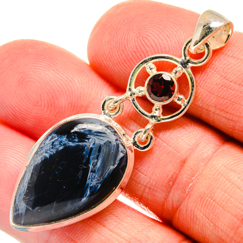 925 sterling silver pendant close-up: blue pietersite drop with red garnet round, bail top