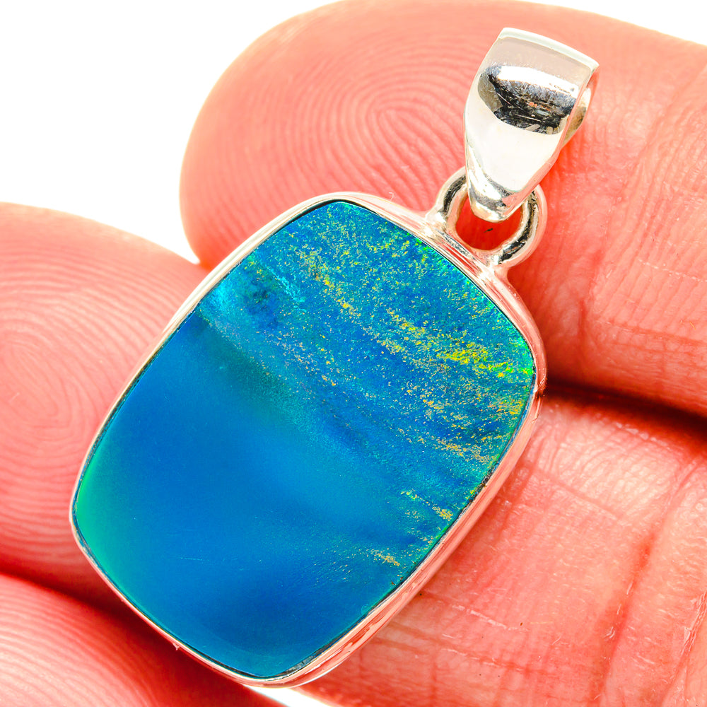 Blue opal pendant in sterling silver bezel with bail, oval cushion shape