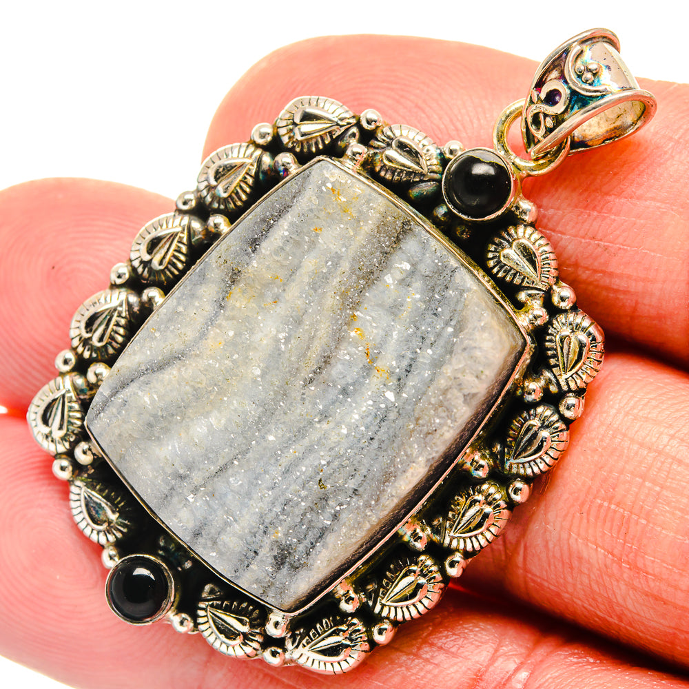 Rectangular druzy pendant with black onyx beads in detailed gold-tone filigree border