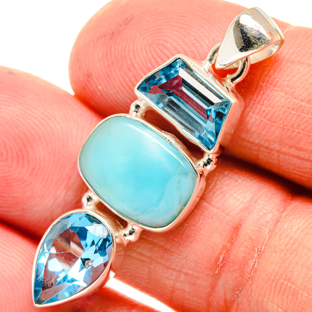 Sterling silver pendant with blue topaz and oval larimar center stone