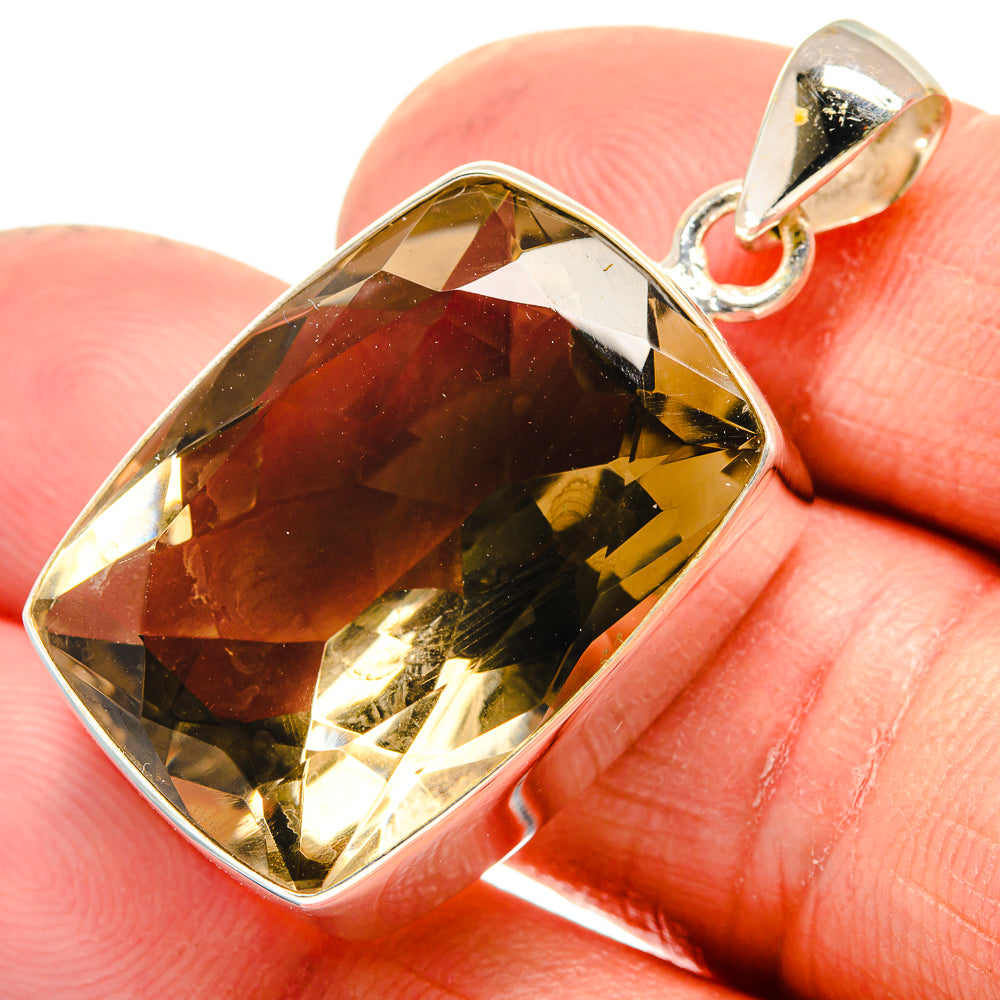 Faceted smoky quartz pendant with silver bail, dark brown gemstone bezel setting