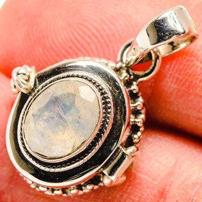 Sterling silver oval moonstone pendant with rope-edge bezel and black accents