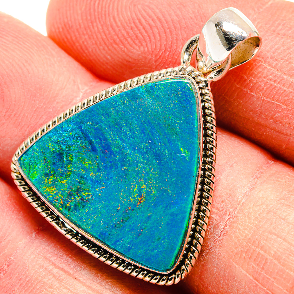 Triangular blue-green opal pendant in 925 silver with textured rope border, close-up