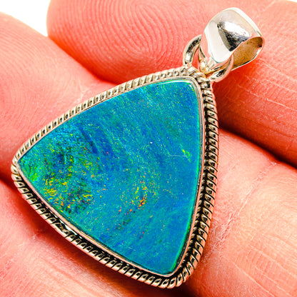 Triangular blue-green opal pendant in 925 silver with textured rope border, close-up