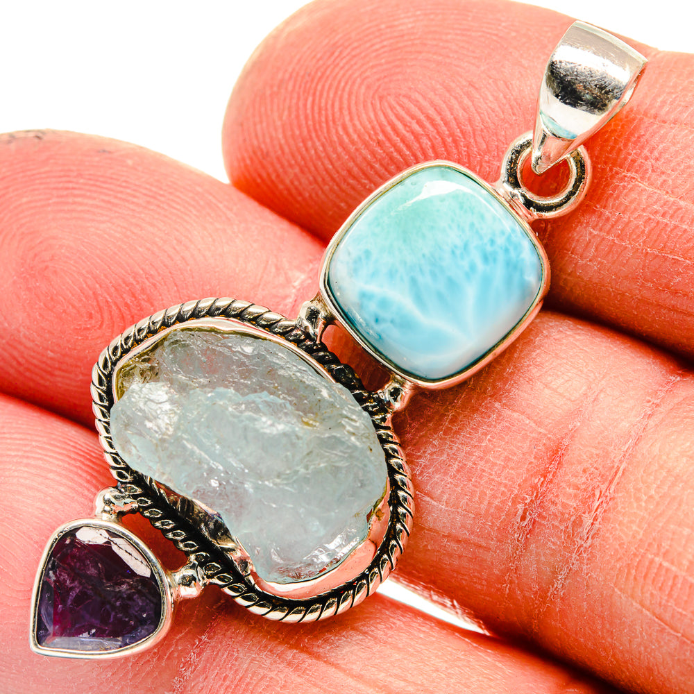 Sterling silver pendant with turquoise oval stone, pale green oval stone, and small purple heart