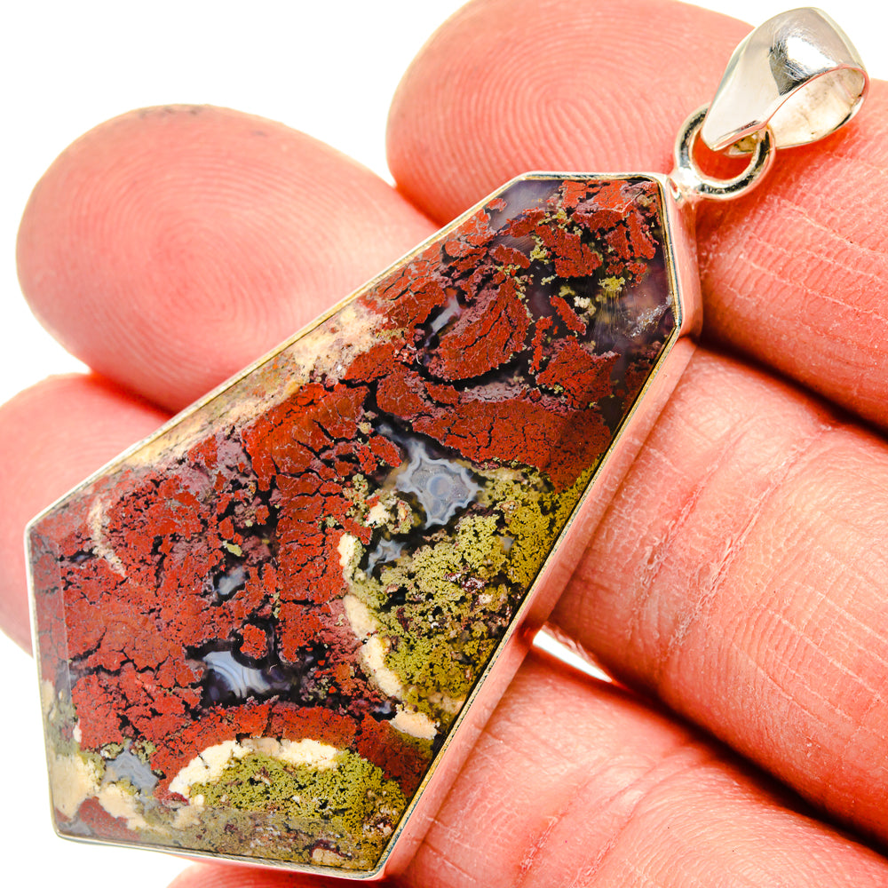 Plume agate pendant close-up, 925 sterling silver bezel; vivid red and black pattern