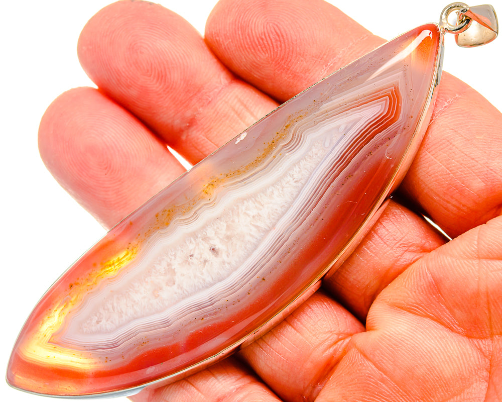 Red geode slice pendant, teardrop shape, white banding, 925 sterling silver bail
