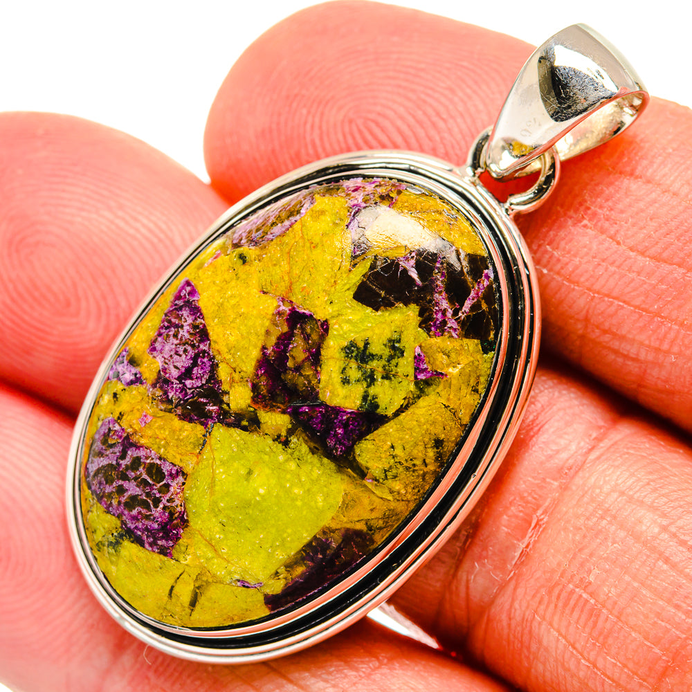 Sterling silver atlantisite pendant, oval bezel set stone in yellow with purple flecks