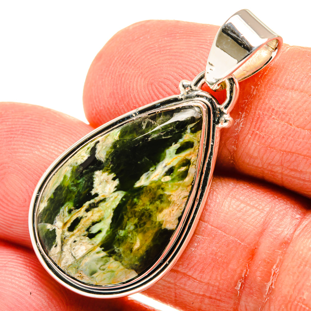Green opal teardrop pendant close-up, bezel-set stone in sterling silver