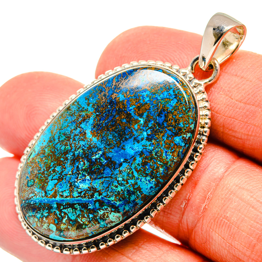Shattuckite pendant in oval bezel with turquoise-blue cabochon and silver bail