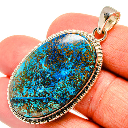 Shattuckite pendant in oval bezel with turquoise-blue cabochon and silver bail