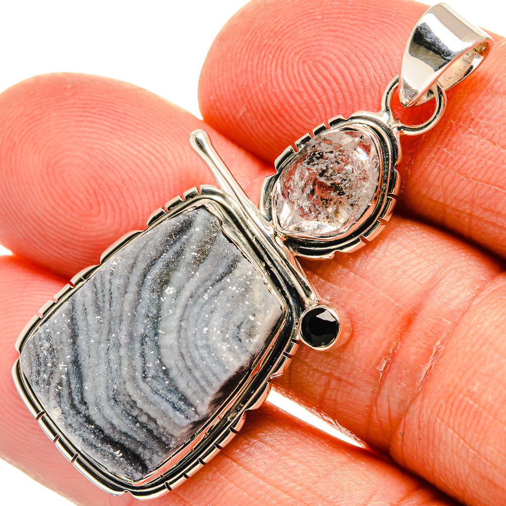 Sterling silver pendant with oval black-and-gray druzy stone and round black onyx