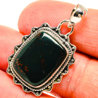 Sterling silver bloodstone pendant with ornate scalloped bezel and teardrop bail