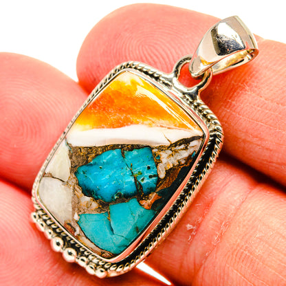 Turquoise oyster shell pendant in silver-tone bezel with bail, teardrop shape