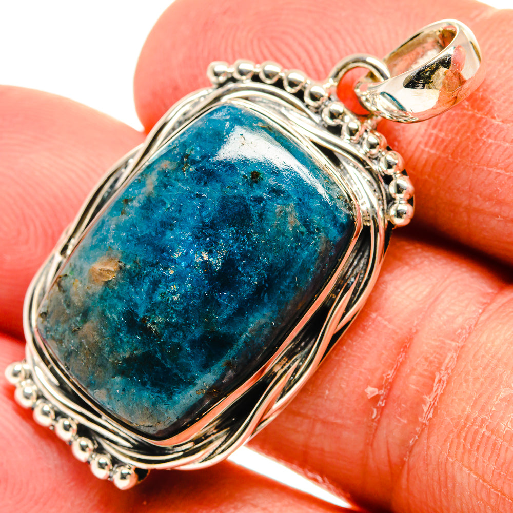 Oval blue-green gemstone pendant in polished 925 sterling silver, close-up