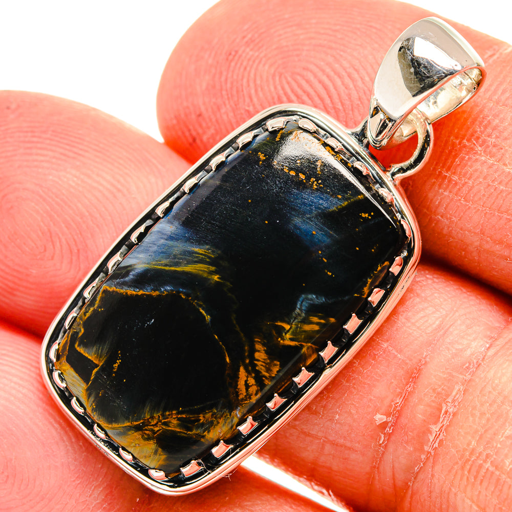 Pietersite pendant with dark blue-black stone, gold veining, silver bezel and bail