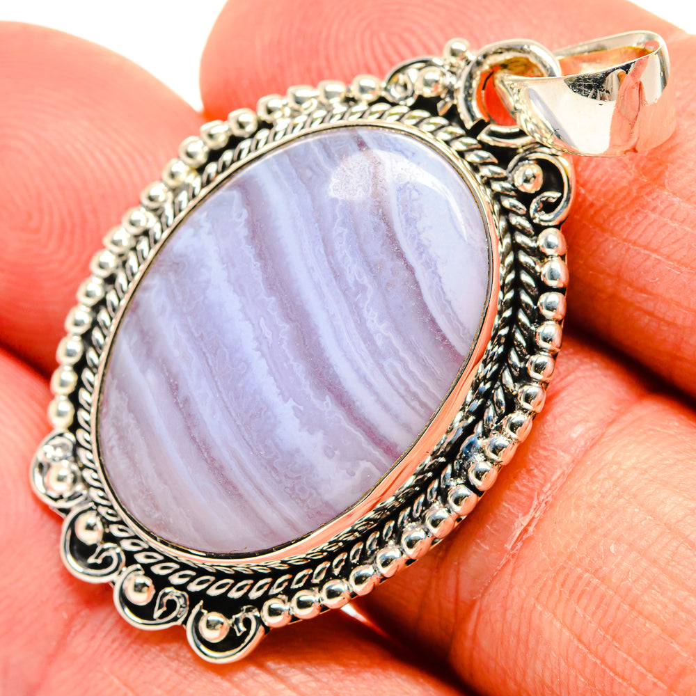 Oval blue lace agate pendant in 925 sterling silver with ornate filigree bezel