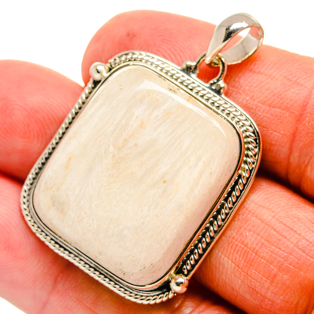 Scolecite pendant in 925 sterling silver with light cream rectangular cabochon and loop bail.
