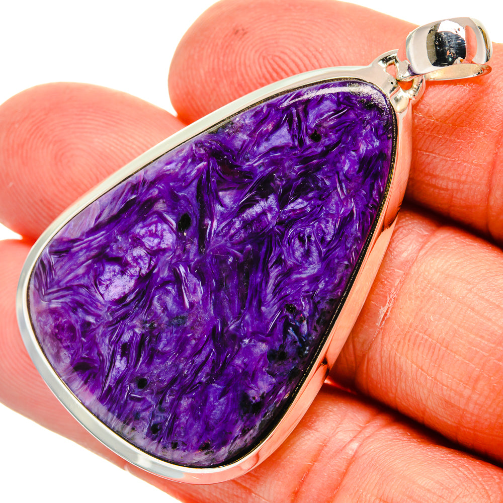 Purple charoite teardrop pendant in 925 sterling silver bezel, close-up bail